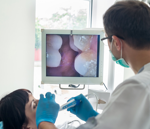 Dentist capturing close up photos of a patients teeth